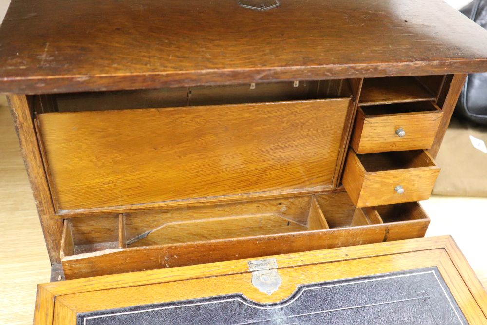 An oak fall-front portable desk